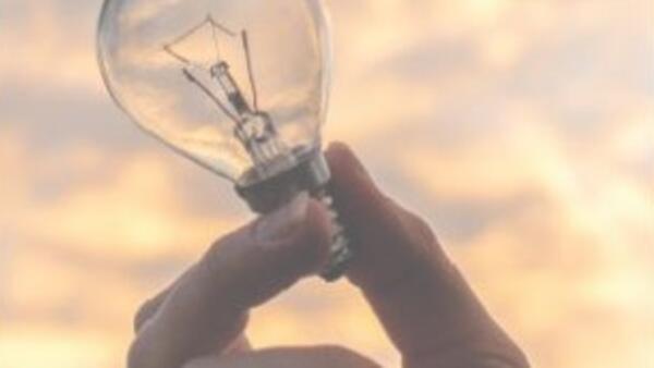 lightbulb in someones hand